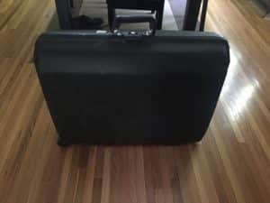 side hustle Samsonite suitcase