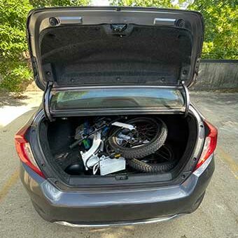 Picture of the Sohamo S3 folded up in the trunk of a car